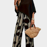 Terēzes ikdienas komplekts no viegla auduma ar apdrukātu blūzi un plūstošām biksēm